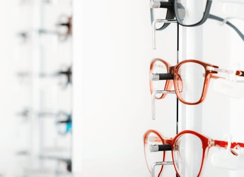 Close up view of optical glasses on stand at optician store