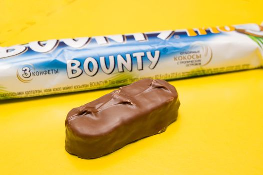 BELARUS, NOVOPOLOTSK - 12 NOVEMBER, 2020: Bounty bar on a yellow background