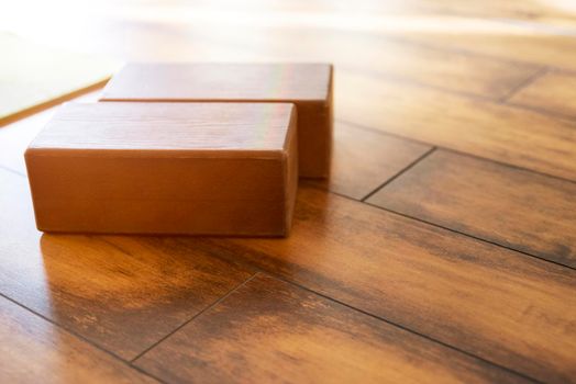 Closeup of wooden blocks yoga equipment in studio