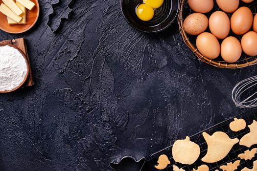 Design concept of making Halloween cookies, baking recipe ingredients layout of preparing party, top view, flat lay, overhead, blank copy space.