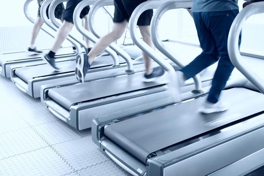 gym shot - people running on machines, treadmill