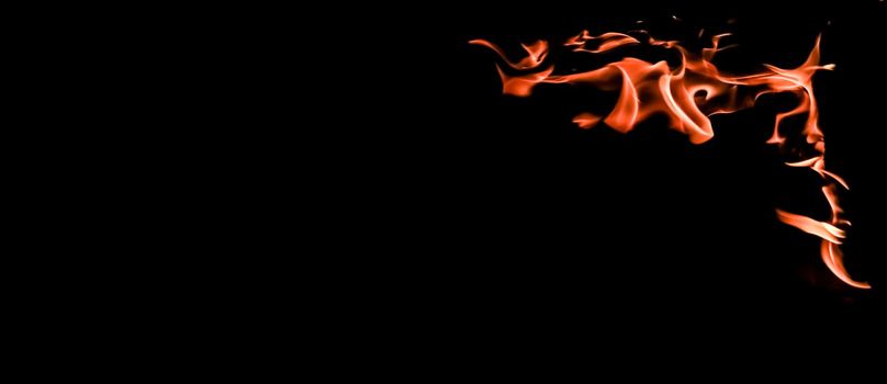 Flames of fire on a black background. The mystery of fire.