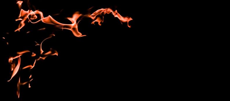 Flames of fire on a black background. The mystery of fire.