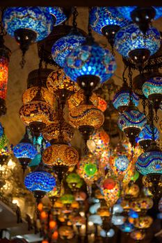 A bunch of multicolored hanging chandeliers on display in touristic shop in Kotor, Montenegro