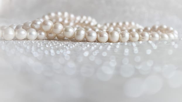 Nature white pearl beads on sparkling background