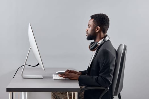 man e-learning lesson african translate person zoom call space education study night work black headphones class video copy computer computer businessman wireless knowledge student laptop american