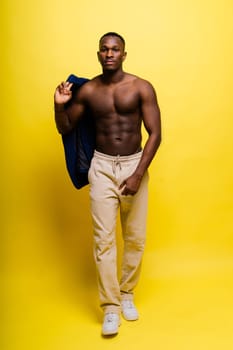 Happy african american young businessman in a formal suit portrait. Confident black guy posing