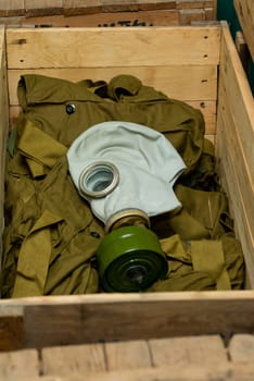 Soviet gas mask in a wooden box. Warehouse of Soviet protective equipment.