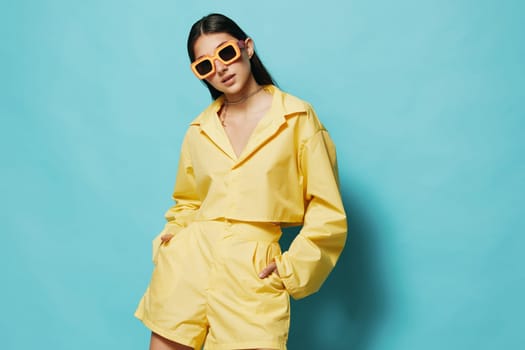romance woman beautiful trendy summertime dance yellow background joy person female fashion attractive long sunglasses young hair lifestyle emotion hairstyle girl happy