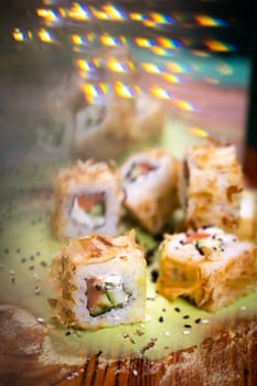 warm rolls on a wooden board with wasabi.