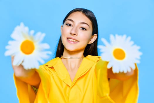 woman flower model valentines blue yellow happiness young care lady positive emotion studio summer portrait cheerful brunette smile chamomile caucasian face day