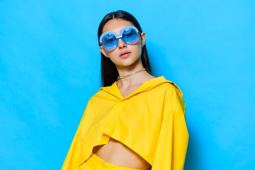 woman hair beautiful style modern gesture long trendy lovely lifestyle yellow sunglasses dance creative fashion emotion cheerful young girl hairstyle attractive fun background