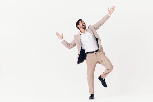 up man model fashion happy suit victory business standing stylish beige idea smiling winner businessman flying running isolated job jacket smile arm
