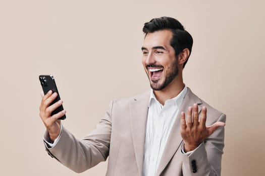 guy man happy connection young phone cell smile portrait hold gray handsome trading corporate call internet business suit smartphone white blogger