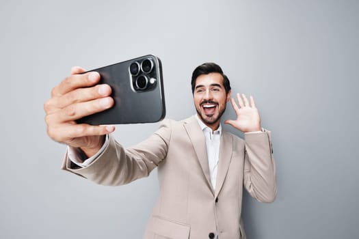 mobile man cell background hold mobile smile portrait suit phone phone success smartphone studio business selfies businessman beige call message happy white