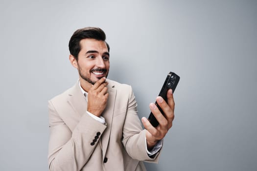 suit man phone hold call portrait online business cyberspace happy selfies communication smile smartphone male message person studio app application internet