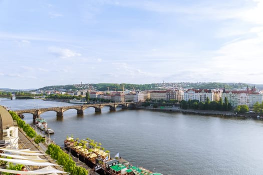 22 May 2022 Prague, Czech Republic. Many tourists relax by the river in restaurants on ships near the embankment.