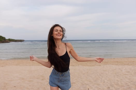 travel woman sexy running hair walking summer young lifestyle sea smiling long fun water smile beach leisure beauty sunset girl ocean sun