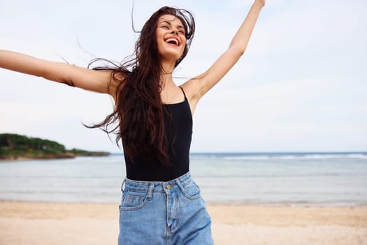 woman ocean beauty space positive sun copy travel happy hair running smile beach sunset summer freedom sea person water lifestyle sand young