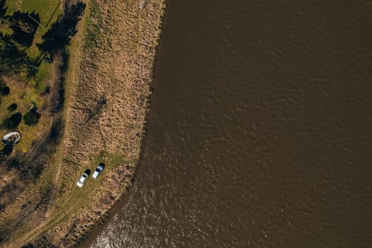 Aerial view drone of two cars on bank river. Concept of Outdoor activity spending time in unity with nature. Getting away. Local travel