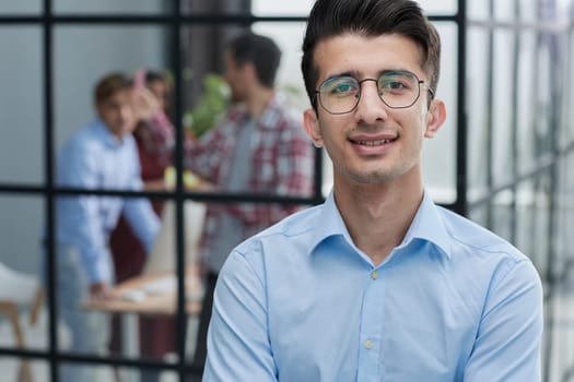 portrait of a young businessman who is smiling