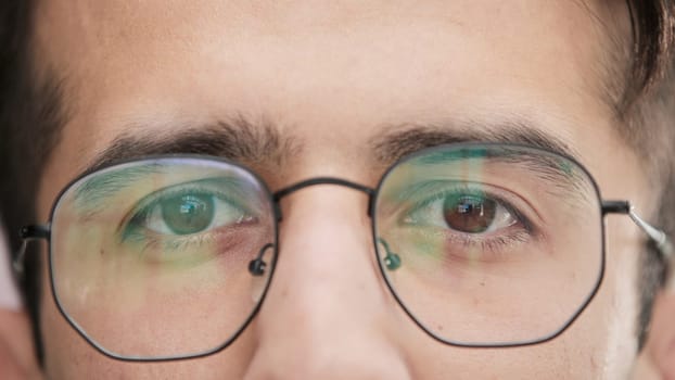 business and education, close-up of male eyes with glasses