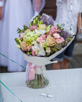 Wedding bouquet close-up. Flower gift for a person. Composition of flowers in a bouquet.