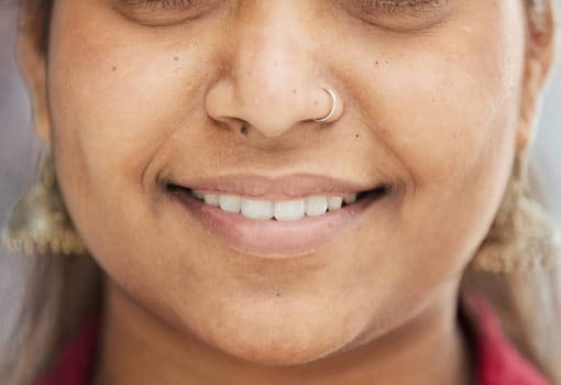 Attractive young woman wearing clothes and smiling, close-up