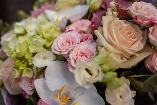 Wedding bouquet close-up. Flower gift for a person. Composition of flowers in a bouquet.