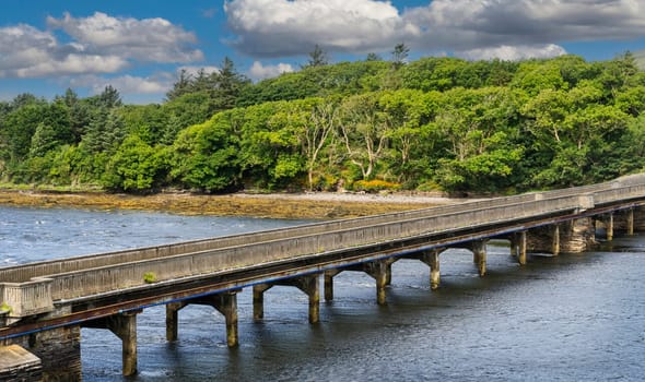 Irish rural landscape near the village of Cahersiveen in southern Ireland. With an bridge across the canal.