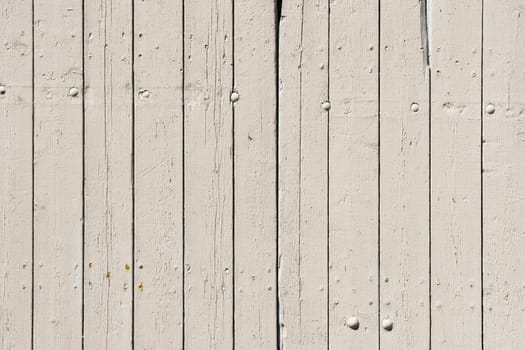 Rustic wood planks with lots of texture in light tones.