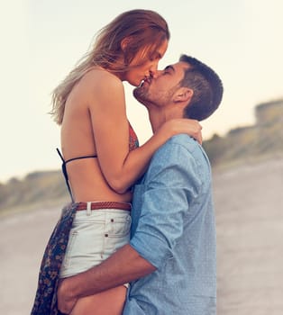 Sweet summer romance. an affectionate young couple at the beach