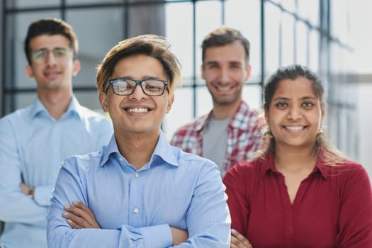 Many business people meet standing in rows with their arms crossed and confident.