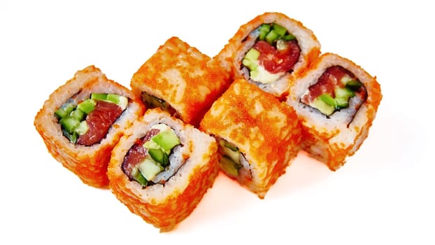 California Maki Sushi with Masago. Roll made of Salmon, Avocado, Cucumber inside. Masago outside. Shallow dof