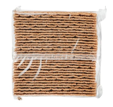 Rye chips on a white isolated background. Rye chips are packed in a transparent polythene package. Rye chips are a healthy alternative to potato and unhealthy chips