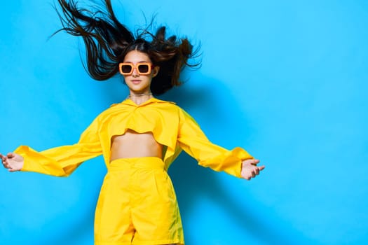 sunglasses woman isolated trendy dance young joyful fashion yellow attractive brunette lifestyle glamour joy hairstyle girl summertime creative gesture person beautiful