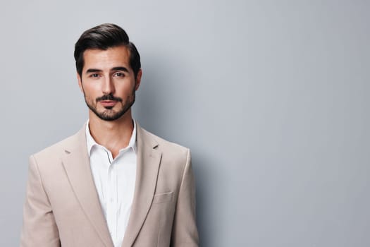 fashion man smile copyspace shirt confident office job happy handsome arm stylish business eyeglass businessman suit portrait beige success smiling grey