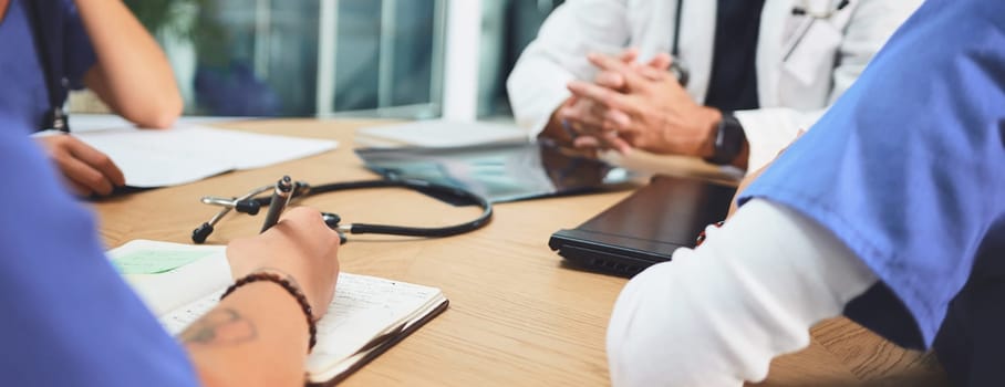 The contribution of everyone matters. Closeup shot of a team of doctors having a meeting in a hospital