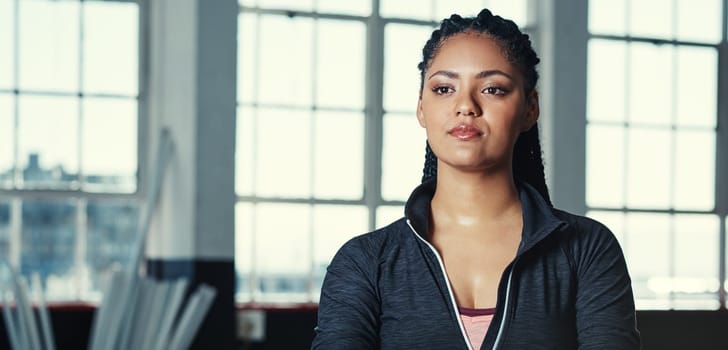 I will not be stopped until I reach my fitness goal. Portrait of a young woman in a gym