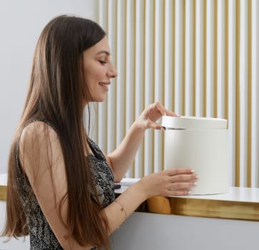 Female receptionist at reception desk with a client