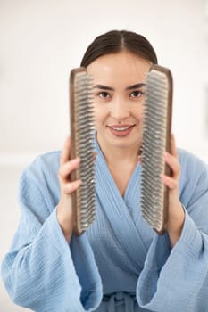 Asian woman holding sadhu boards on face background