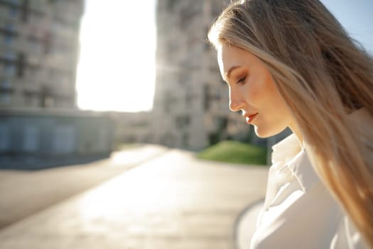 Close up portrait of young blonde businesswoman outdoors