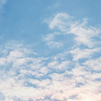 Background of blue sky with white clouds. Natural backdrop