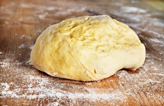 Uncooked dough on wooden table ,preparing food