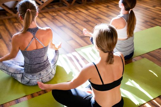 Yoga Class, Group of People Relaxing and Doing Yoga pose