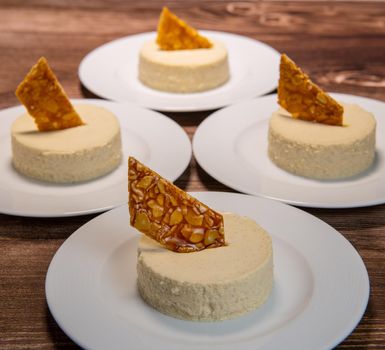 Bavarian recipe with pear and vanilla served with almond nougatine. High quality photo