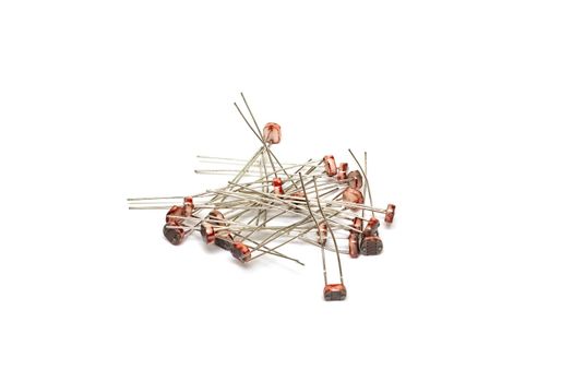 A bunch of photoresistors isolated on a white background close up