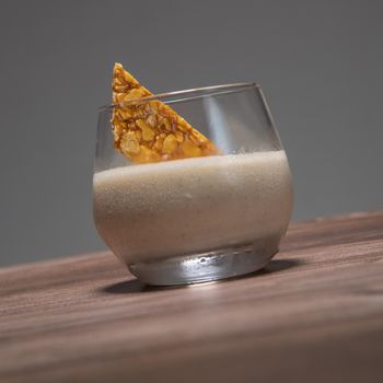 Bavarian recipe with pear and vanilla served with almond nougatine. High quality photo