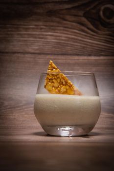 Bavarian recipe with pear and vanilla served with almond nougatine. High quality photo