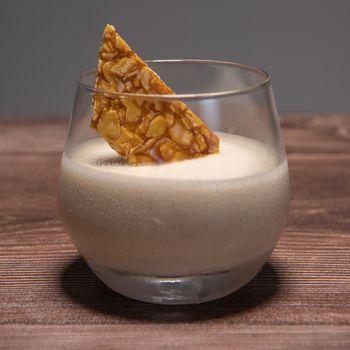 Bavarian recipe with pear and vanilla served with almond nougatine. High quality photo